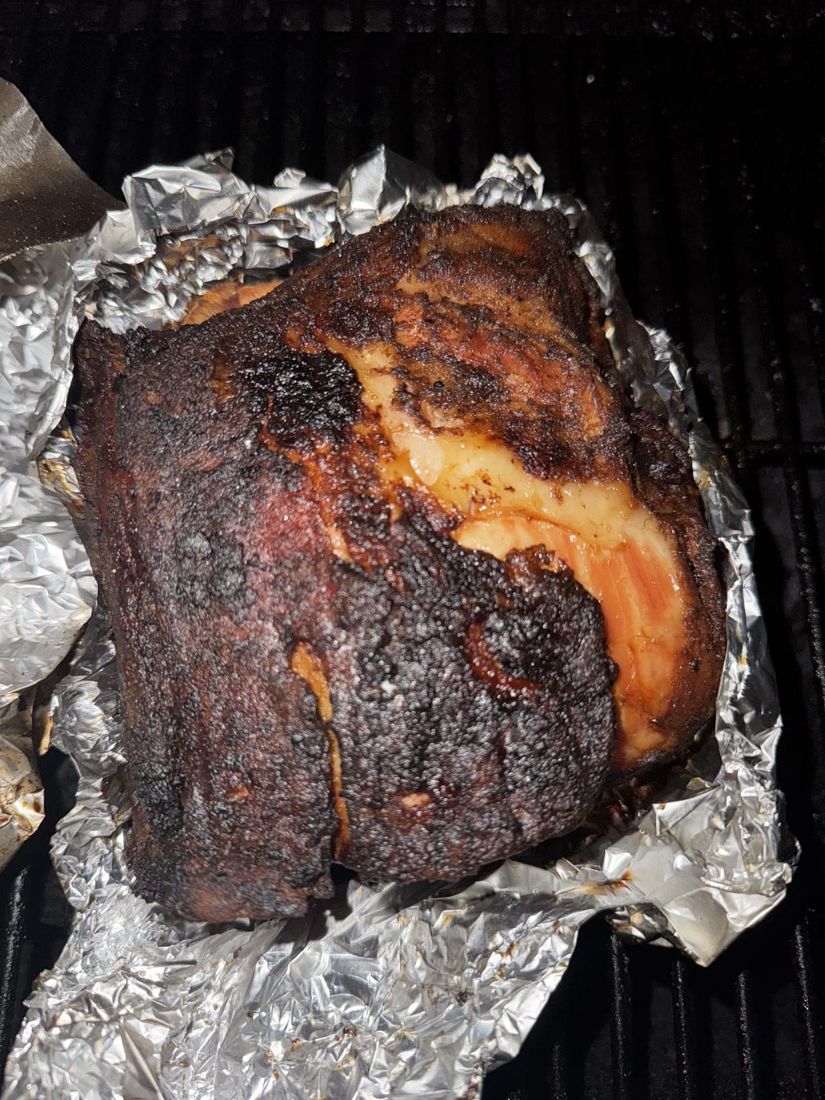 Smoked pork shoulder with crispy bark in foil